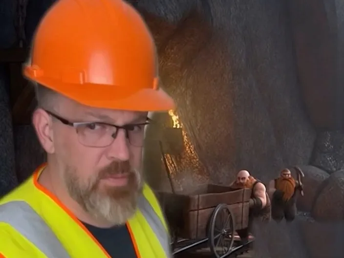 Clipboard in hand, inspecting the mine