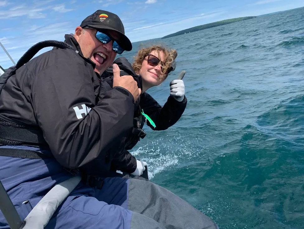 Thumbs up from the rail while sailing