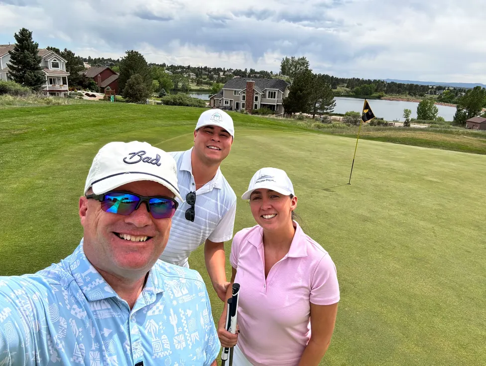 Three of the team on the golf green